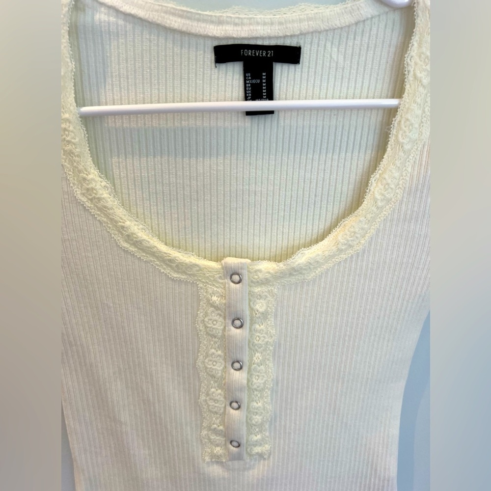 Forever 21 bodysuit with white floral pattern around neck. - Picture 3 of 5